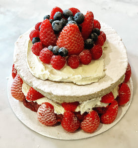 Luxury Low carb Victoria Sandwich cake. Two layer vanilla sponge filled and topped with double cream. decorated with fresh strawberries, raspberries and blueberries 